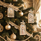 Painted MelodyCast Christmas ornaments with angel, winter cottage and candle designs hanging on a decorated Christmas tree