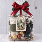 Painted MelodyCast Christmas tree ornament displayed on a festive holiday gift basket